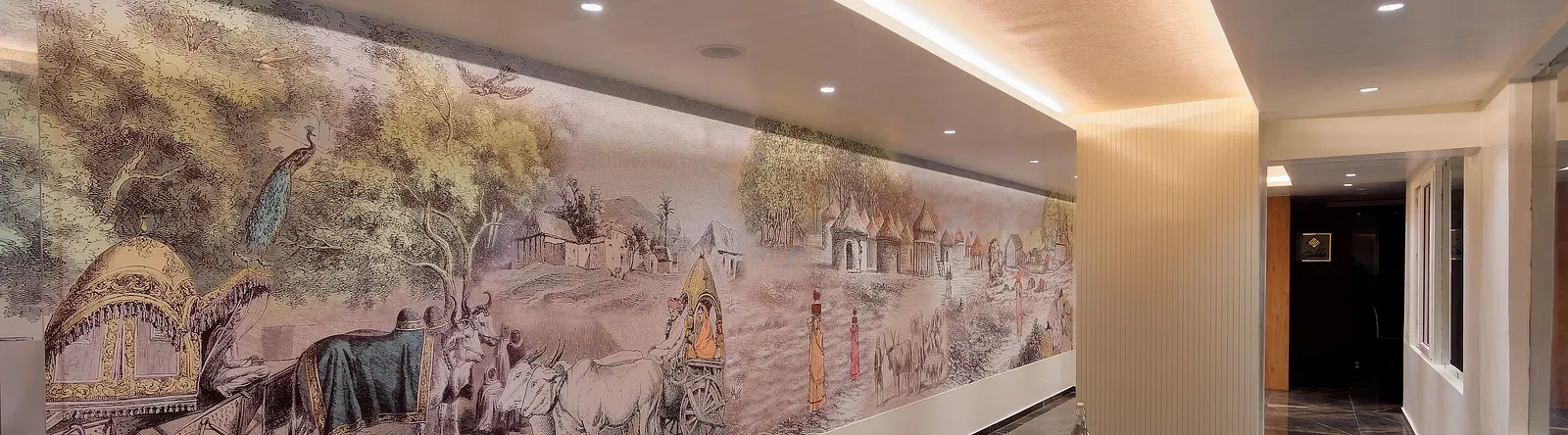 Image of seating area with chairs and tables and mural on the wall at Ankit Hotel, Jabalpur