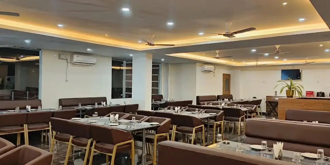 Dining arrangement in a restaurant at ANS M Square Hotel & Resort, Kalaburagi