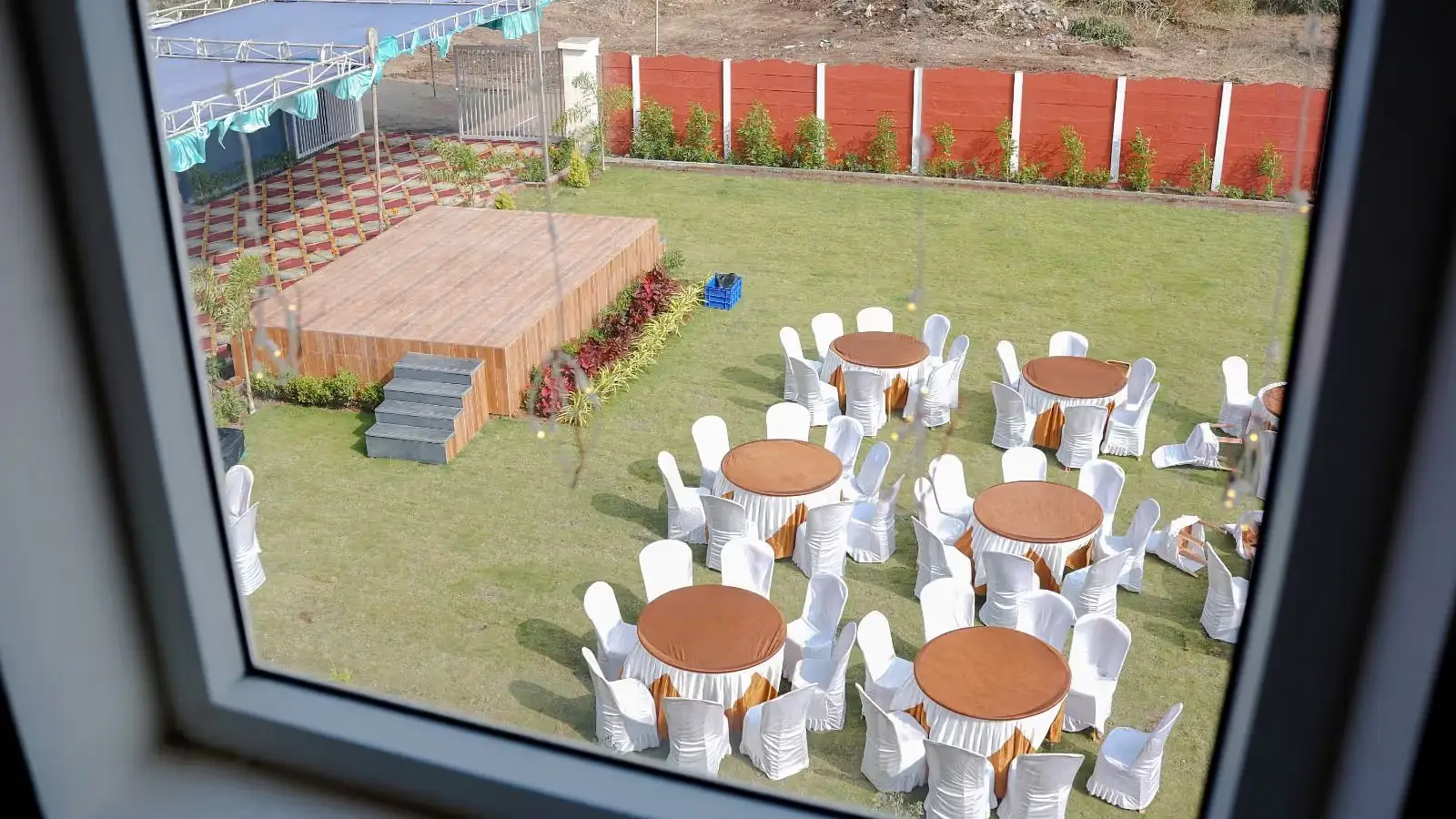 Seating and stage arrangement in the garden area of ANS M Square Hotel & Resort, Kalaburagi